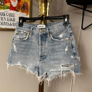 Womens distressed light wash denim shorts by Agolde size 24